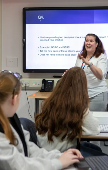 Students fully engaged in an interactive lesson at Glasgow Kelvin College, led by their enthusiastic lecturer encouraging lively classroom discussion. Students fully engaged in an interactive lesson at Glasgow Kelvin College, led by their enthusiastic lecturer encouraging lively classroom discussion.